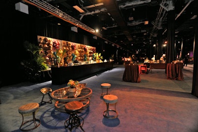 The Rough Luxe area had rustic wood seating at wagon-wheel tables. A wall of cowboy hats backed a 48-foot wooden bar.