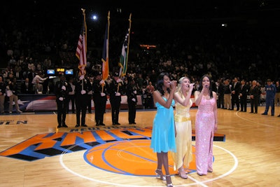 The BlueGirls sing the anthem at the Garden in NYC.