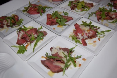 Cuisine Solutions served sliced beef carpaccio with a citrus vinaigrette at its pavilion.