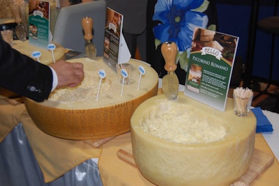 Arthur Schuman cheeses created its display directly from the product itself carving out samples from each of three cheese wheels, which then became a serving bowl for attendees.