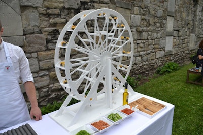 The mac and cheese station was set up as a two-part offering: guests could either select a mini serving placed on a spinach cone off a Ferris-wheel-shaped stand, or opt for a full cup that could be customized with toppings like veggie bacon bits, truffle oil, jalapenos, scallions, or sriracha sauce.