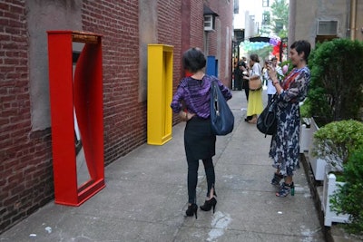 To access the main space for the event, guests had to walk through a long passageway. As a fun diversion, the producers set up a series of funhouse mirrors that hinted at the presentation's carnival motif.