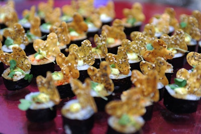 The waitstaff served sushi bites atop clear trays.