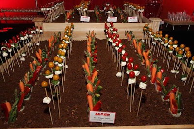 For the grand opening of the Miami Airport Convention Center in Miami earlier this year, the venue's catering team created an edible garden using toasted pumpernickel crumbs as 'dirt' with spears of baby carrots, asparagus spears, and zucchini, as well as baby tomatoes and buffalo mozzarella 'flowers.'