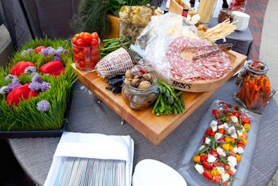 Aragosta's offerings included a salad of fresh mozzarella, tomatoes, and green beans. The buffet table was spruced up summer-picnic-style with flowers, grasses, and jars of vegetables.