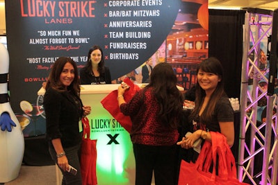 Attendees met with representatives from Lucky Strike Lanes at their booth.