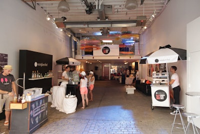The block party took place inside and around the Cooper Classic Cars gallery, with food carts, two bars, and picnic tables for guest seating. For a refreshing treat, guests sipped on 'adult icies,' or shaved ice spiked with vodka, by People's Pops.