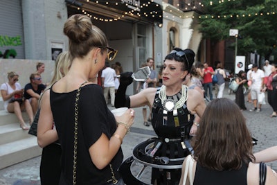 As a fun way to promote sunglasses, Relevent brought out performance artist Joey Arias who sported a skirt-like shelving structure to display the products.