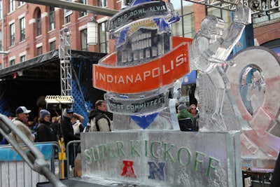 Randy Finch and Derek Maxfield, stars of the Food Network show Ice Brigade, put on live ice-sculpting performances in this year's Super Bowl Village. Naturally, their frozen sculptures had a sporty theme.