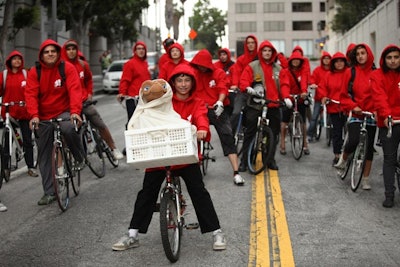Re-creating a scene from the movie, more than 100 people biked to a screening of E.T. The Extra-Terrestrial at an event celebrating its 30th anniversary and forthcoming release on Blu-ray.