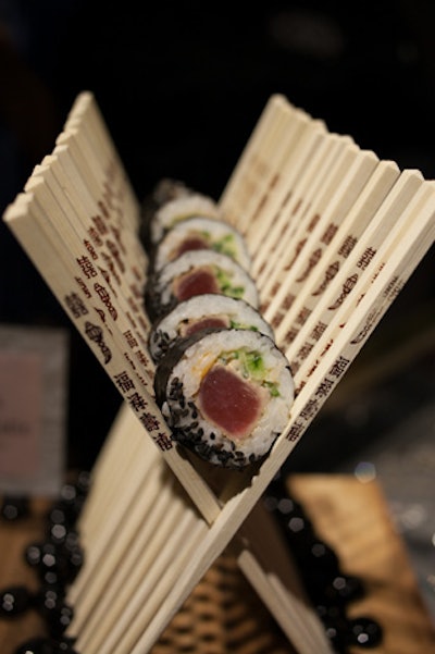 At an in-store promotion for Juicy Couture in May, Truffleberry Market served seared ahi tuna sushi rolls with black sesame and pink pickled ginger. The bites were festively displayed in a row of crossed chopsticks.
