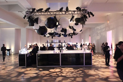 A streamlined, modern bar stood at the center of the room with an arrangement of black and white lanterns hanging overhead. Liquor sponsors Domaine Chandon and Belvedere offered cocktails, including the Summer Fling, a mix of Chandon brut sparkling and Belvedere pure vodka, with lemon juice and a dash of simple syrup.