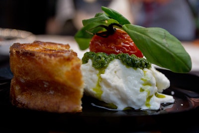 Mozza chefs Nancy Silverton and Matt Molina served caprese, a concoction of burrata with basil pesto and rosemary-infused tomatoes with a baguette crouton, taking inspiration from Attack of the Killer Tomatoes.