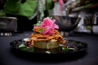 Chef Rick Bayless's cochinita pibil, a concoction of slow-roasted achiote-marinated pork, pickled onions, and habanero salsa served on a black bean tamalon, inspired by Once Upon a Time in Mexico.