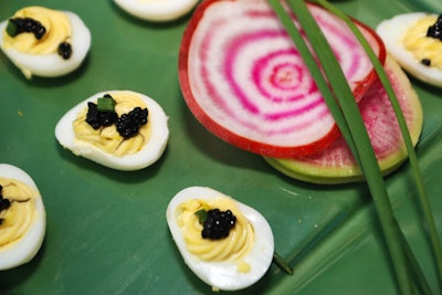 Limelight handled catering, providing bite-size snacks for the cocktail reception and a three-course dinner. Some of the appetizer trays were decorated with quarters under Lucite, a nod to the organization's 25th year.