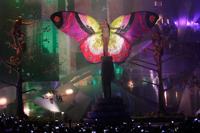 Katy Perry emerged from a cocoon and sprouted butterfly wings as she sang 'Wide Awake.' The platform she stood on slowly raised above the stage.