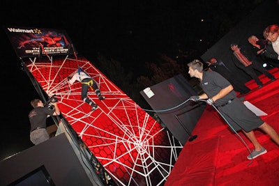 Guests took their turns on a climbing wall at the Amazing Spider-Man premiere party.