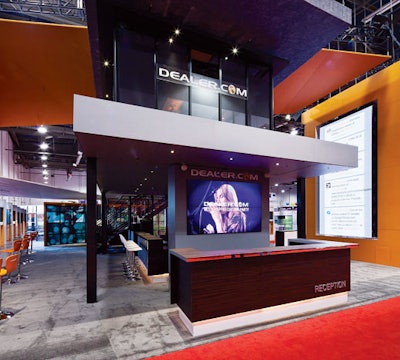 Tangram designed a two-story exhibit dubbed “The Garage” for dealer.com at the 2012 National Automobile Dealers Association show. The space functioned as a social venue, with a lounge, a DJ booth, and a bar, in addition to conference rooms and product demonstration stations.