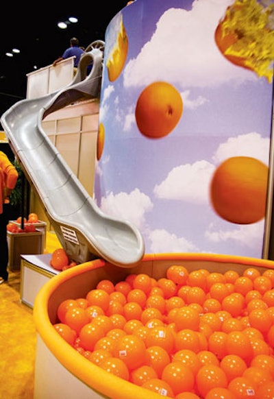 At the 2012 P.G.A. Merchandise Show, Cobra Puma Golf had a booth created by CEP Exhibit Productions, Inc. with a playful two-story structure. The ground floor served as a meeting space, while the top floor included the entrance to a slide that ended in a pit of orange balls.