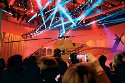 At Heli-Expo 2012 in Dallas, Global Experience Specialists staged a splashy presentation to reveal Bell Helicopter’s new top-secret helicopter. After screening a short documentary, a Kabuki drop revealed a series of large, angled walls that came to life via a 3-D video mapping presentation, eventually moving to reveal the helicopter.