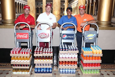 Soda distributors greeted guests to the publisher's reception near a similarly branded bar.