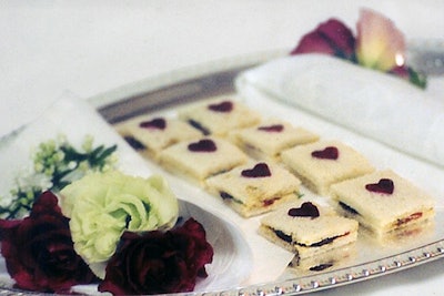 British-born chef Ro Howe helms New York's Barraud Caterers. Although the firm tailors menus to individual events, it does have quite a few English classics in its arsenal, like these tea sandwiches, filled with crab-celery salad, beets, and walnut goat cheese butter, and topped with heart-shaped beets.