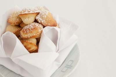 Warm Madelines: miniatures of the classic French cake sprinkled with powdered sugar.