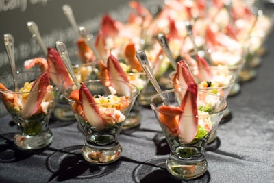 East Meets West Catering uses stemless martini glasses to hold fresh lobster served with spicy mango and horseradish sauce, and garnished with purple endive and micro greens.