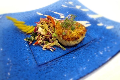 Newport Beachside Hotel & Resort's Kitchen 305 serves a white truffle jumbo lump crab cake with white truffle horseradish yogurt aioli and spicy Asian cabbage slaw.