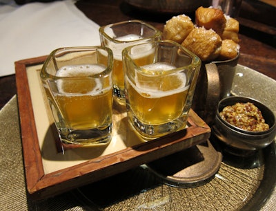 As a late-night snack, Marcey Brownstein Catering & Events serves mini pretzel bites alongside whole grain mustard and shots of Hefeweizen.