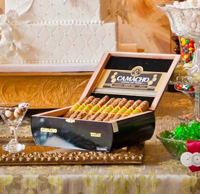 For a recent dessert display created by Chicago-based Sugar Chic Designs, Nicole Greene of Truffle Truffle contributed caramel chocolate-covered pretzels rolled in beer batter toffee and displayed in a cigar box.