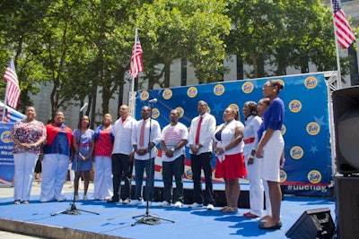 After McPhee's act, the DBC Ensemble of Queens—decked out in the colors of the flag—entertained the crowd with a soulful performance of 'God Bless America.'