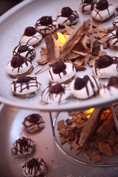 Poste restaurant served a twist on the classic s'mores with a bourbon-flavored marshmallow on a graham cookie with bacon-chocolate drizzle and a candied cherry.