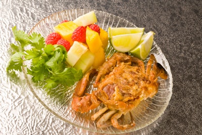 La Bonne Maison’s summer offerings include a plated soft-shell crab with a fruity salad of raspberry, mango, and melon.