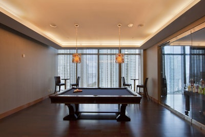 The billiard room, adjacent to the virtual bowling alley and the corporate lounge areas.