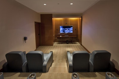 The 3-D media room seats 14 in comfortable leather recliners and features a 65-inch Samsung active 3-D television.