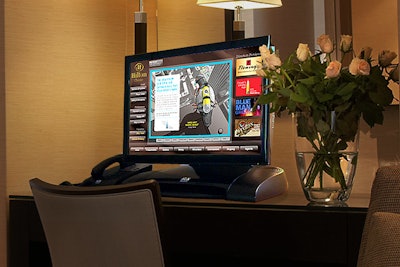 The Hotel Communication Network's Navigator system operates on a touch-screen computer equipped with a phone. By the end of the year, the company will have installed these computers in nearly 5,000 hotel rooms in Chicago.