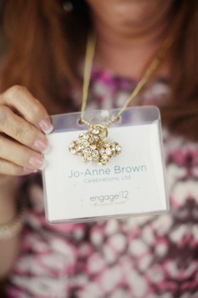 Name badges doubled as an icebreaker: the number of crystal charms on the tag identified how many times the badge-wearer had attended an Engage! conference. Veteran attendees had nine balls, while first-timers had only one.