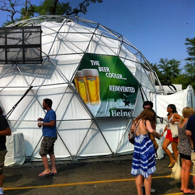 Heineken had a dome-shaped tent meant to represent a reinvented beer cooler. After having their IDs checked, guests entered the air-conditioned space to find open bars doling out the Dutch beer on tap. Darkened and shot through with green light—the brand's signature hue—the tent had projection videos of real-time Pitchfork concerts playing on its ceiling. The California-based Corso Communications produced the activation.