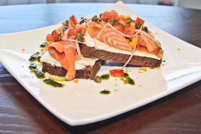 New to the menu at SHOR American Seafood Grill at Hyatt Key West Resort and Spa is a 12-hour, mandarin- and thyme-cured wild Alaskan salmon dressed with julienned shallots, capers, tomato, egg white, and cream cheese on toasted pumpernickel bread. It is dressed with dill-infused olive oil. The dish, from executive chef Dan Elinan, is part of Hyatt's healthy food and beverage initiative.