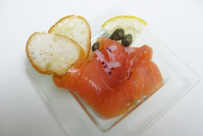 Sant Ambroeus is offering an appetizer called 'salmone fresco,' consisting of smoked salmon topped with chives and a light balsamic reduction.