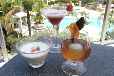 The Hilton Orlando's new cocktail menu includes three 'Breakfast of Champions' cocktails, made with breakfast ingredients like Froot Loops and bacon. The particularly autumnal 'Bacon Reserve' (pictured, far right) contains Woodford Reserve bourbon that has been sous vide with brown sugar, orange zest, and bacon. The drink is garnished with a piece of chocolate-covered bacon. The 'Bottom of the Cereal Bowl,' (pictured, far left) mixes different flavors of Bacardi rum with raspberry syrup and half-and-half, and comes topped with Froot Loops.