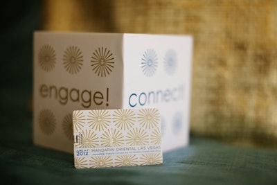 Flexible branded paper cubes served as easy decor throughout the conference. Custom USB cards included event information as well as all 250 attendees’ contact information, which avoided the need to pass out business cards.