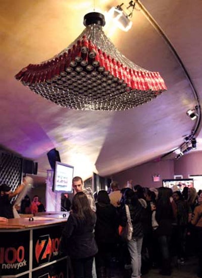 To add some branding to the Z100 & Coca-Cola All-Access Lounge at the Hammerstein Ballroom in New York last December, sponsor Coca-Cola fashioned a chandelier from aluminum bottles of Coke.
