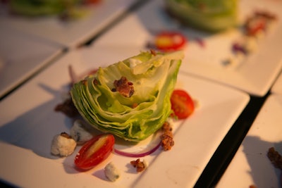 Steak-house-style side dishes at the carving station included individual iceberg wedge salads that were dressed to order with blue cheese dressing, tomatoes, and red onions. There were also dutch ovens holding creamed spinach and cast-iron skillets filled with hash brown potatoes.