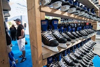 All Year Sports Galaxy donated unused skates for the promotion. On-site at the skate-rental counter, attendees can check out skates in their size. Wooden cube-like shelves inside the globe serve as lockers to hold belongings.