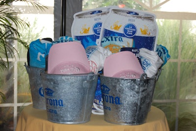 Corona Extra gave away three buckets of branded merchandise such as towels, hats, and snap koozies in a raffle at the brand's Alumni Night party on Tuesday.