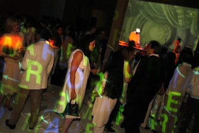In 2006, nonprofit art organization Performa instructed its guests to wear white—the combined 'canvas' of their outfits served as moving screens for colorful video projections produced by Gerrit Vooren and Brian Miller of Reels4Artists.