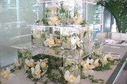 At Tourism Toronto's client reception in 2007, a three-tiered acrylic structure that was accented with wild white flowers and green vines served as a display for all-white chocolate sushi bites.