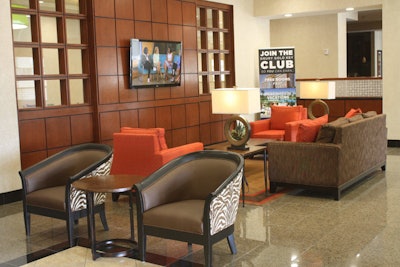 The hotel's lobby has lounge seating and a widescreen TV.